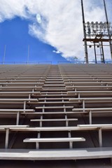 Stadium Bleachers with Blue Sky and Clouds