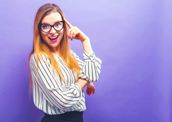 Happy young woman on a solid background