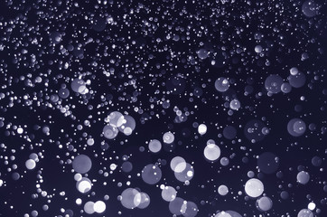 abstract blue bokeh glitter sparkle background.