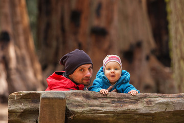 Father with infant son visit Sequoia national park in California, USA