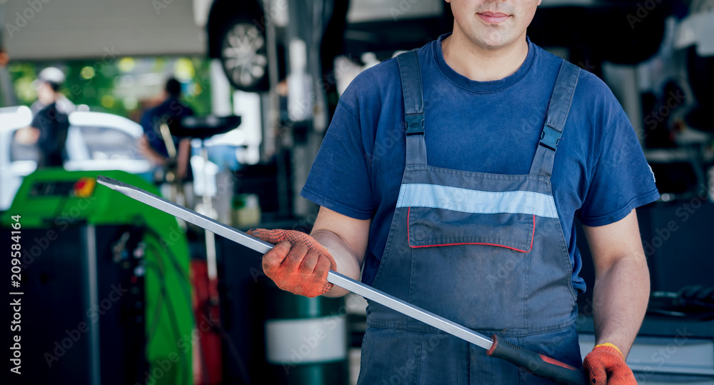 Wall mural tools at the hands. auto repair