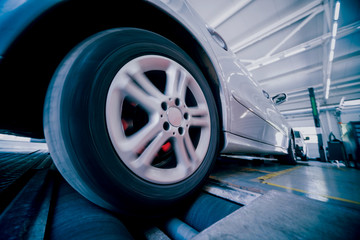 Automotive suspension test and brake test rolls in a auto repair service.