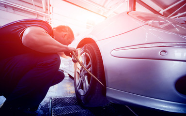 Automotive suspension test and brake test rolls in a auto repair service.