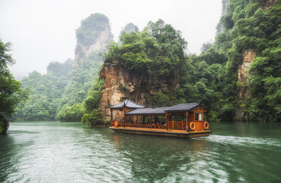 Baofeng Lake Boat Trip in a rainy day with clouds and mist at Wulingyuan, Zhangjiajie National Forest Park, Hunan Province, China, Asia