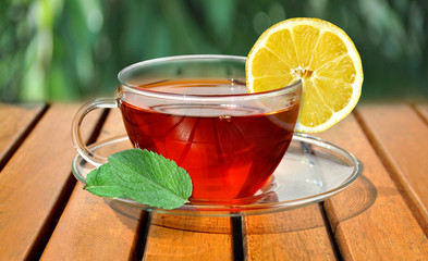 Cup of tea with lemon and fresh mint © Dariusz