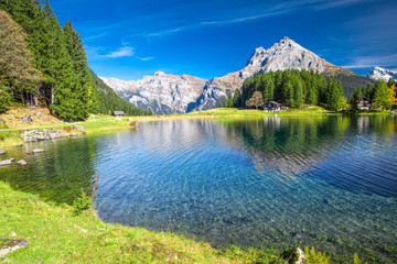 Arnisee lake with Swiss Alps. Arnisee is a reservoir in the Canton of Uri, Switzerland - obrazy, fototapety, plakaty