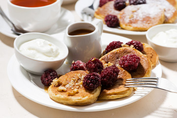 sweet corn pancakes with berries for breakfast