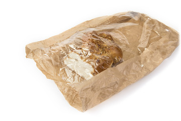 Raisin nuts bread pack in used brown paper bag