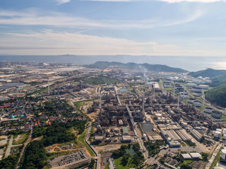 Industrial view at oil refinery plant form industry zone with sunrise and cloudy sky.Oil refinery and Petrochemical plant at dusk,Thailand. Aerial view