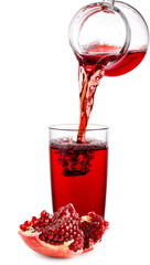 Pomegranate juice poured from jug into glass