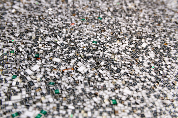 Electronic components in bulk. Texture of chip resistors