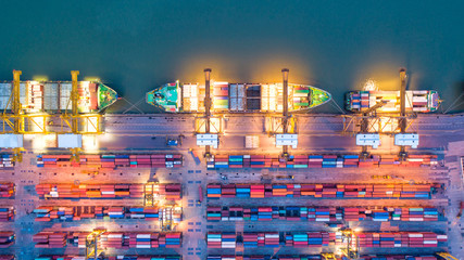 Container ship in export and import business and logistics. Shipping cargo to harbor by crane. Water transport International. Aerial view and top view. - obrazy, fototapety, plakaty