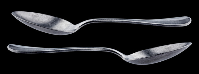 Metal spoon isolated on black background