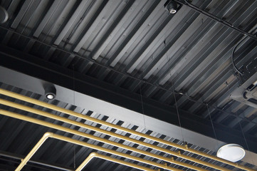 golden tubes, air conditioning and fixtures, on the ceiling