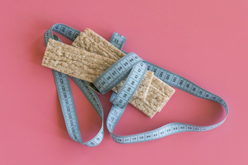 the loaves and the tape diet slim health on a pink background. slimming loaves