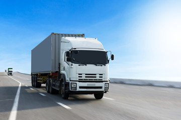 Truck on highway road with container, transportation concept.,import,export logistic industrial Transporting Land transport on the asphalt expressway.