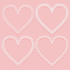 Set of openwork white frames in the shape of lace hearts. Design elements on pink background. Vector illustration - obrazy, fototapety, plakaty
