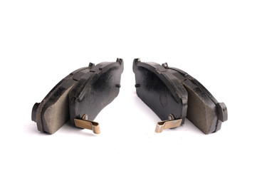 Set of 4 pieces of new front disc brake pads, isolated on white