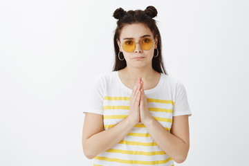 I beg you help me out. Troubled serious and gloomy girlfriend in stylish outfit and sunglasses,...