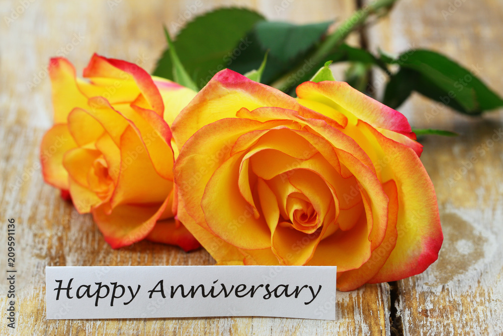 Wall mural Happy Anniversary card with two orange roses on rustic wooden surface
 - Wall murals