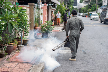 Man fogging to eliminate mosquito for prevent spread dengue fever