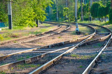 Fototapeta na wymiar The rails and the arrow for the railway, the fork of the road.