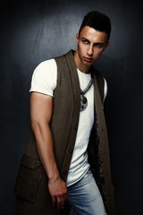 Obraz premium portrait of handsome stylish young man posing in studio