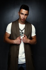 portrait of handsome stylish young man  posing in studio