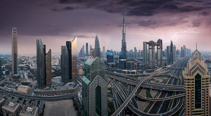 Fototapeta na wymiar Dubai skyline during sunset with amazing city center lights and road traffic UAE.
