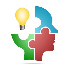 The human head composed of colored puzzle pieces with yellow bulb with gray shadow below the head on a white background. Human head composed of geometric element 