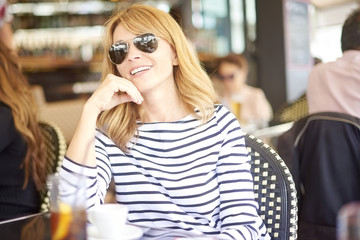 Attractive woman sitting at cafe