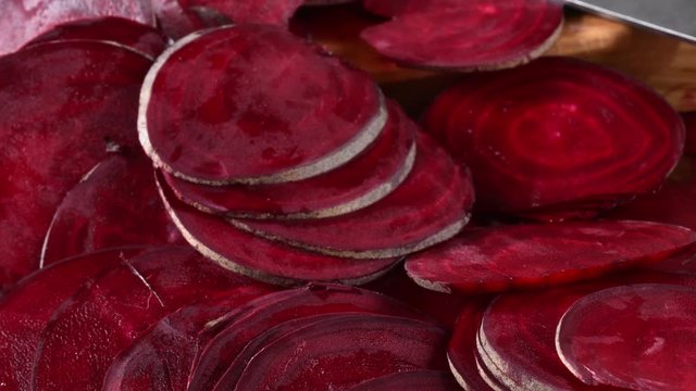 Fresh organic sliced beets on a cutting  board