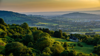 A golden sunset in summer overlooking the countryside from  Crickley hill near Gloucester, Gloucestershire  UK 