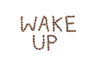Wake up phrase made from roasted coffee beans isolated on white background