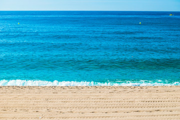 Spain seavies in summer. Blue beach waves.