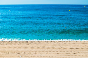 Spain seavies in summer. Blue beach waves.