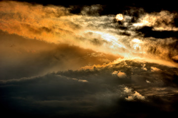 Fototapeta na wymiar sunlight through dark clouds