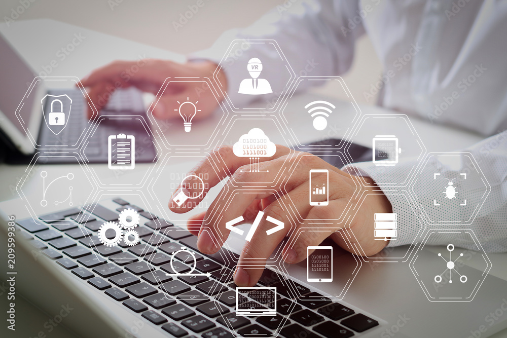 Poster close up of businessman typing digital tablet with keyboard and laptop computer on white desk in modern office
