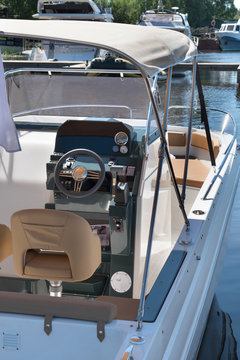 Luxury yacht control wheel and interior of a transport motorboat