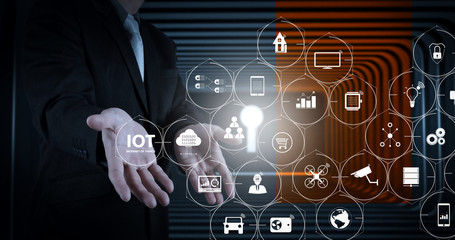 businessman open hands to a gate shaped like a keyhole