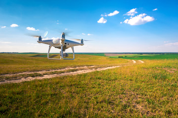 Fototapeta na wymiar drone quad copter on green corn field