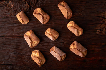 Homemade buns stuffed with cottage cheese on a wooden background. Macro photo. Selective focus.