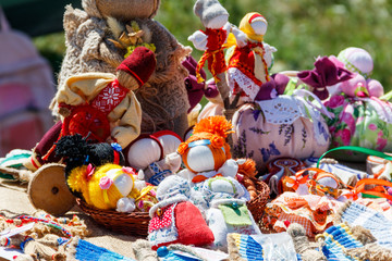 Dolls toys handmade souvenirs at the exhibition of folk arts