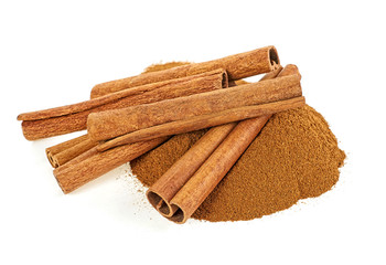 Cinnamon sticks and powder on white background