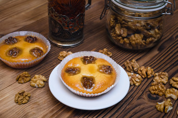 Shortbread cookies with walnuts and honey and cup of hot tea.