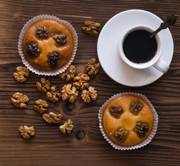 Obraz na płótnie Canvas Shortbread cookies with walnuts and honey and cup of black coffee.