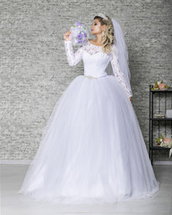 Fototapeta premium The girl in a fashionable wedding dress