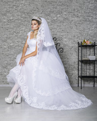 Fototapeta na wymiar The girl in a fashionable wedding dress