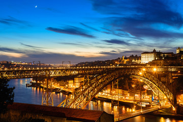 Porto, Portugal old town skyline with Dom Luis bridge in the night from vila nova de gaia