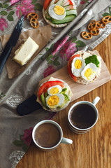Man holding crisp toast with avocado, cream butter and egg over table. Useful fat and nutritious. Healthy breakfast lunch snack